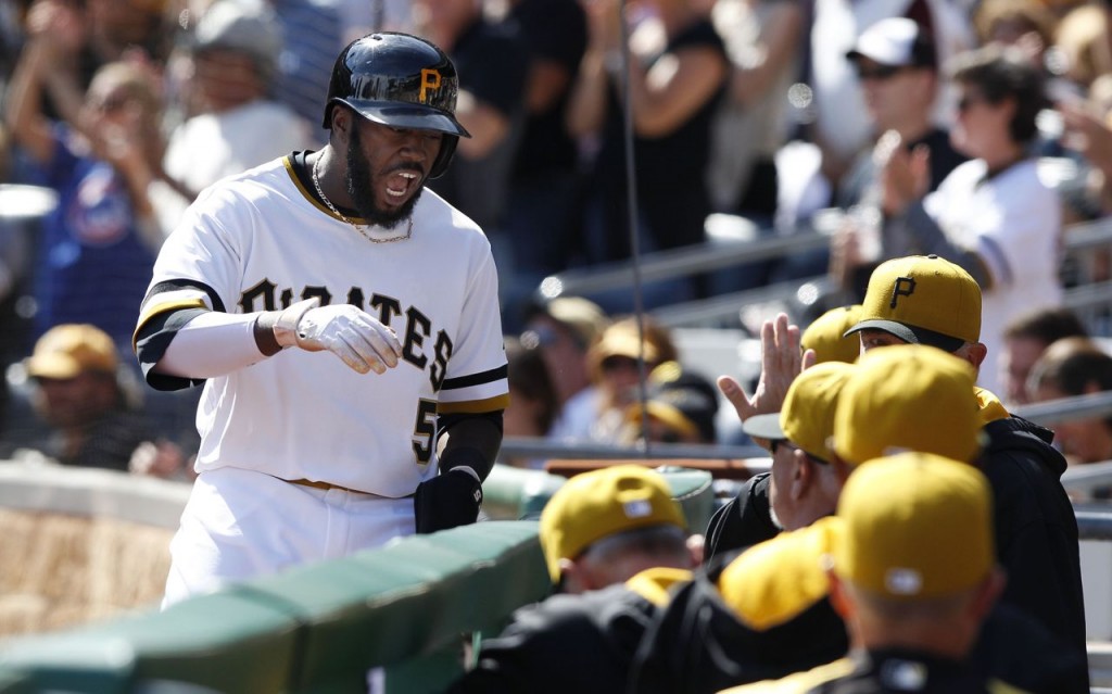 Josh Harrison shouts toward the Pirates' dugout after his two-run double tied the score in the fifth inning. -- GETTY IMAGES