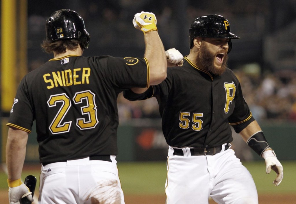 Russell Martin is welcomed back to the Pirates' dugout after his home run Friday night. -- GETTY IMAGES