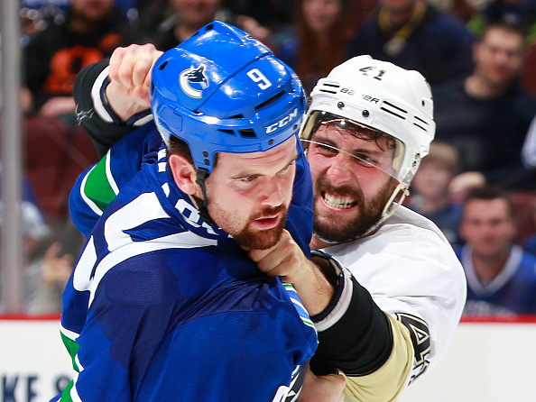 Robert Bortuzzo and the Canucks' Zack Kassian fight Saturday in Vancouver. -- GETTY