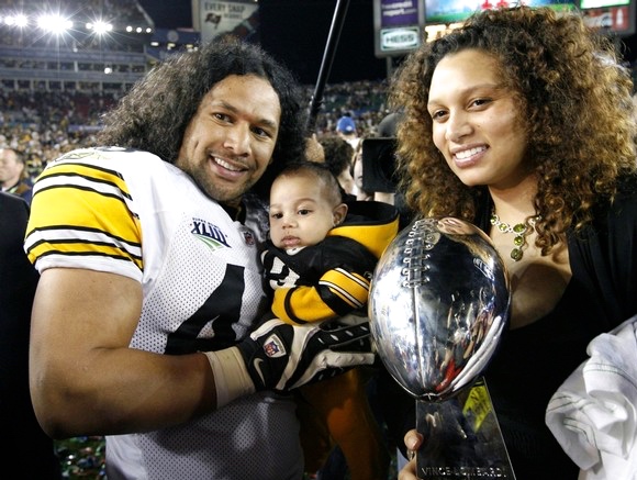 Pittsburgh Steelers safety Troy Polamalu poses with family and Vince Lombardi Trophy after win over Arizona Cardinals in Super Bowl XLIII football game in Tampa